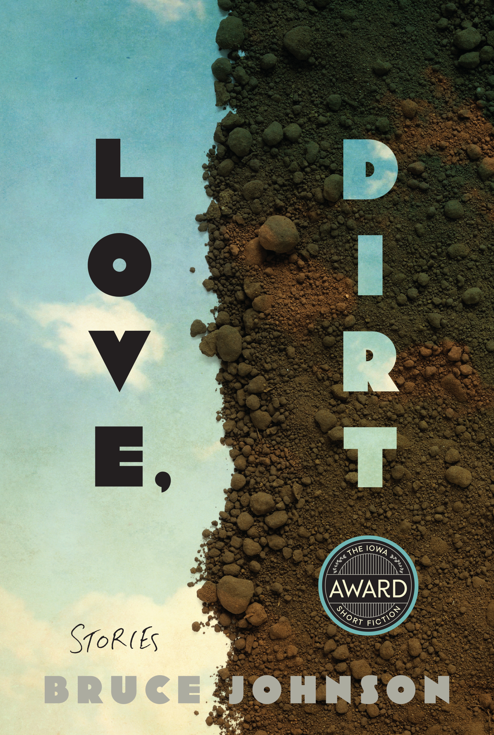 Book cover for 'Love, Dirt: Stories' by Bruce Johnson. The title is split across a striking visual divide - 'Love,' in dark letters appears over a blue sky/water background on the left, while 'Dirt' in light letters appears over an earth-toned landscape of soil and rocks on the right. The cover includes 'The Iowa Award Short Fiction' badge and the author's name at the bottom.